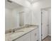 Bright bathroom showcasing a double sink vanity, granite counters, and a well-lit mirror at 3536 Moscato Dr, Brooksville, FL 34602