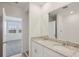 Modern bathroom with double sink vanity, granite countertop, and separate shower room at 3536 Moscato Dr, Brooksville, FL 34602