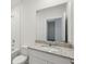 Bathroom with granite vanity, framed mirror and shower-tub combo at 3536 Moscato Dr, Brooksville, FL 34602