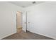 Bedroom featuring carpet, base trim, and an open doorway leading to a tiled room at 3536 Moscato Dr, Brooksville, FL 34602