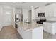 Bright kitchen with stainless steel appliances, granite countertops, and a center island with a sink at 3536 Moscato Dr, Brooksville, FL 34602