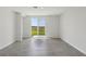 Bright living room with tile floors and sliding glass doors leading to the backyard at 3536 Moscato Dr, Brooksville, FL 34602