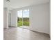 Living Room leading to the outdoor patio space and nice lawn views at 3536 Moscato Dr, Brooksville, FL 34602