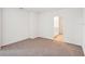 Neutral bedroom with carpet flooring, base molding and minimal decor at 437 Lazy Shore Dr, Nokomis, FL 34275