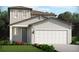 Charming two-story home with a gray door, two-car garage, and well-manicured lawn at 437 Lazy Shore Dr, Nokomis, FL 34275