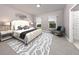 Elegant bedroom showcases natural light, neutral decor, and a luxurious upholstered bed at 461 Sun Chaser Dr, Nokomis, FL 34275