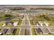 Gorgeous aerial view of a residential community with pond and manicured landscaping in a desirable neighborhood at 10008 Last Light Gln, Parrish, FL 34219