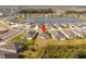 Aerial view of a residential community surrounding a picturesque lake at 10008 Last Light Gln, Parrish, FL 34219