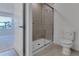 Bathroom featuring glass shower and tile flooring at 10008 Last Light Gln, Parrish, FL 34219