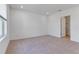 Spacious bedroom features neutral carpet, natural light, and an ensuite bathroom at 10008 Last Light Gln, Parrish, FL 34219