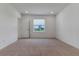Bright bedroom with neutral carpet and window view at 10008 Last Light Gln, Parrish, FL 34219
