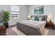 Cozy bedroom with a comfortable bed, a large window, and tasteful decor elements at 10008 Last Light Gln, Parrish, FL 34219