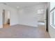 Open bedroom features neutral carpet and access to other rooms at 10008 Last Light Gln, Parrish, FL 34219