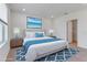 Comfortable bedroom with a calming decor, a large bed, and soft lighting at 10008 Last Light Gln, Parrish, FL 34219