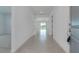 Inviting foyer with tile flooring that leads to the spacious living area and sliding glass doors at 10008 Last Light Gln, Parrish, FL 34219