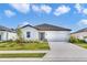 Beautiful single-story home with a well-manicured lawn and attached two-car garage at 10008 Last Light Gln, Parrish, FL 34219