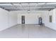 Garage with epoxy flooring and laundry area at 10008 Last Light Gln, Parrish, FL 34219