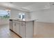Modern kitchen featuring an island with sink and dishwasher, plus stainless steel appliances at 10008 Last Light Gln, Parrish, FL 34219