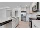 Bright kitchen with stainless steel appliances, modern cabinetry and a large island at 10008 Last Light Gln, Parrish, FL 34219