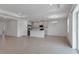 Open-concept living room featuring tile floors, recessed lighting and an adjacent kitchen at 10008 Last Light Gln, Parrish, FL 34219
