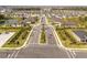 Planned community with lush landscaping, palm-lined streets, and serene lake views at 10008 Last Light Gln, Parrish, FL 34219