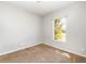 This carpeted bedroom has a window that lets in lots of natural light at 2174 Brubeck Rd, North Port, FL 34287