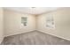 Cozy bedroom featuring plush carpet, neutral walls, and natural light at 626 Belleview Blvd, Clearwater, FL 33756