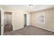 Comfortable bedroom with neutral walls, carpet, and a closet at 626 Belleview Blvd, Clearwater, FL 33756