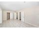 Spacious bedroom with tiled floors and doors to bathroom and closets at 626 Belleview Blvd, Clearwater, FL 33756
