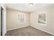 Bright bedroom with new carpet, neutral walls and ample natural light at 626 Belleview Blvd, Belleair, FL 33756