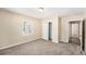 Comfortable bedroom with neutral walls, carpet, and a closet at 626 Belleview Blvd, Clearwater, FL 33756