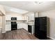 Updated kitchen featuring white cabinets, granite countertops, and new appliances at 626 Belleview Blvd, Clearwater, FL 33756