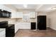 Updated kitchen featuring white cabinets, granite countertops, and new appliances at 626 Belleview Blvd, Clearwater, FL 33756