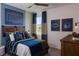 Themed bedroom with a unique decor, comfortable bed, and a matching window treatment at 9548 Vibrant Lane, Venice, FL 34292