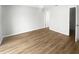 Spacious bedroom with wood-look floors and a neutral color palette at 22162 Weeks Blvd, Land O Lakes, FL 34639