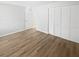 Clean, bright bedroom with light wood floors and ample closet space for storage at 22162 Weeks Blvd, Land O Lakes, FL 34639