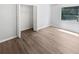 Bedroom with wood-look flooring and a closet at 22162 Weeks Blvd, Land O Lakes, FL 34639