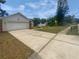 Charming home featuring a two-car garage, long driveway, and well-manicured landscaping at 22162 Weeks Blvd, Land O Lakes, FL 34639