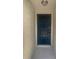 Close-up of the navy-blue front door featuring a digital lock and peep hole at 22162 Weeks Blvd, Land O Lakes, FL 34639