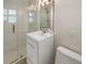 Modern bathroom featuring a glass-enclosed shower, sleek vanity, and contemporary fixtures at 4825 W Bay Court Ave, Tampa, FL 33611