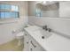 Bright bathroom with a white vanity, updated fixtures, and ample counter space at 4825 W Bay Court Ave, Tampa, FL 33611