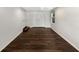 Spacious bedroom featuring a ceiling fan, dark wood floors, and a window at 4825 W Bay Court Ave, Tampa, FL 33611