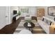 Bright living room showcases a stylish seating area, modern furniture, and natural light at 4825 W Bay Court Ave, Tampa, FL 33611