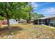 Large backyard features a screened patio, shed, and wooded fence perfect for gardening and outdoor activities at 5208 30Th W St, Bradenton, FL 34207