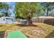 Large backyard showcases a storage shed and shade tree, offering ample space for outdoor activities and storage at 5208 30Th W St, Bradenton, FL 34207