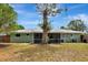 Spacious backyard with lush greenery, screened patio, offering a serene outdoor retreat at 5208 30Th W St, Bradenton, FL 34207
