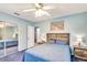 Comfortable bedroom with mirror closet door and blue walls with beach scene picture at 5208 30Th W St, Bradenton, FL 34207