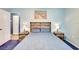 Comfortable bedroom with wood furnishings, blue walls, and a ceiling fan at 5208 30Th W St, Bradenton, FL 34207