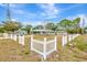 Charming home showcasing a picket fence and well-kept yard, enhancing curb appeal and neighborhood charm at 5208 30Th W St, Bradenton, FL 34207