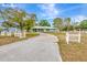 Inviting home with a long driveway, surrounded by trees, offering a tranquil setting and ample parking at 5208 30Th W St, Bradenton, FL 34207